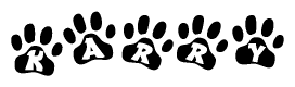 The image shows a row of animal paw prints, each containing a letter. The letters spell out the word Karry within the paw prints.