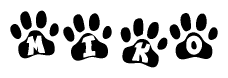 The image shows a series of animal paw prints arranged in a horizontal line. Each paw print contains a letter, and together they spell out the word Miko.