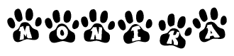 The image shows a series of animal paw prints arranged in a horizontal line. Each paw print contains a letter, and together they spell out the word Monika.