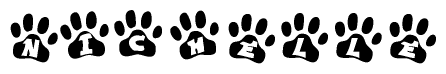 The image shows a series of animal paw prints arranged in a horizontal line. Each paw print contains a letter, and together they spell out the word Nichelle.