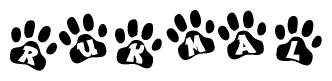 The image shows a series of animal paw prints arranged in a horizontal line. Each paw print contains a letter, and together they spell out the word Rukmal.
