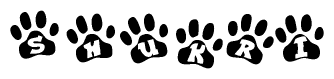 The image shows a series of animal paw prints arranged in a horizontal line. Each paw print contains a letter, and together they spell out the word Shukri.