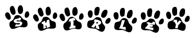 The image shows a row of animal paw prints, each containing a letter. The letters spell out the word Shirley within the paw prints.
