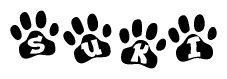 The image shows a series of animal paw prints arranged horizontally. Within each paw print, there's a letter; together they spell Suki