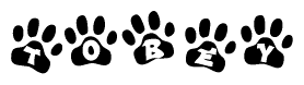 The image shows a series of animal paw prints arranged horizontally. Within each paw print, there's a letter; together they spell Tobey