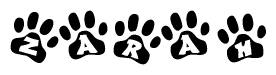 The image shows a series of animal paw prints arranged in a horizontal line. Each paw print contains a letter, and together they spell out the word Zarah.