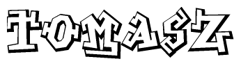 The image is a stylized representation of the letters Tomasz designed to mimic the look of graffiti text. The letters are bold and have a three-dimensional appearance, with emphasis on angles and shadowing effects.