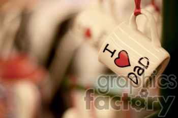   The clipart image shows a mug (cup) with the words "I love dad" written in bold red letters on a white background. The word "love" is represented by a heart symbol. This image is commonly used to express affection and appreciation towards one