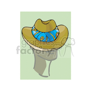 This clipart image features a cowboy hat with a colorful patterned band on a neutral background. The hat is placed on the top of a head silhouette, giving it a 3D appearance.