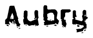 This nametag says Aubry, and has a static looking effect at the bottom of the words. The words are in a stylized font.