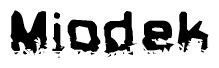 The image contains the word Miodek in a stylized font with a static looking effect at the bottom of the words