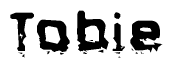 The image contains the word Tobie in a stylized font with a static looking effect at the bottom of the words