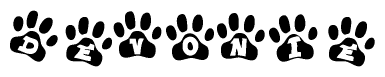 The image shows a row of animal paw prints, each containing a letter. The letters spell out the word Devonie within the paw prints.