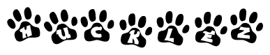 The image shows a series of animal paw prints arranged horizontally. Within each paw print, there's a letter; together they spell Hucklez