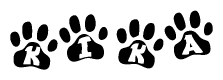 The image shows a series of animal paw prints arranged in a horizontal line. Each paw print contains a letter, and together they spell out the word Kika.