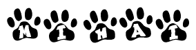   The image shows a row of animal paw prints, each containing a letter. The letters spell out the word Mihai within the paw prints. 