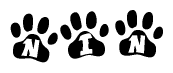 The image shows a series of animal paw prints arranged horizontally. Within each paw print, there's a letter; together they spell Nin