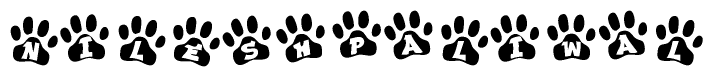 The image shows a series of animal paw prints arranged horizontally. Within each paw print, there's a letter; together they spell Nileshpaliwal