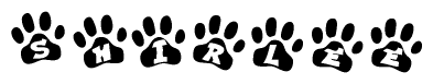 The image shows a series of animal paw prints arranged in a horizontal line. Each paw print contains a letter, and together they spell out the word Shirlee.