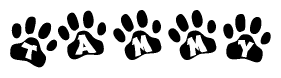 The image shows a series of animal paw prints arranged in a horizontal line. Each paw print contains a letter, and together they spell out the word Tammy.