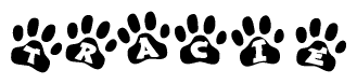 The image shows a series of animal paw prints arranged horizontally. Within each paw print, there's a letter; together they spell Tracie
