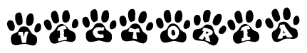 The image shows a row of animal paw prints, each containing a letter. The letters spell out the word Victoria within the paw prints.