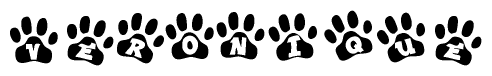 The image shows a series of animal paw prints arranged in a horizontal line. Each paw print contains a letter, and together they spell out the word Veronique.