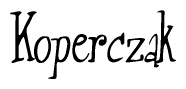 The image contains the word 'Koperczak' written in a cursive, stylized font.