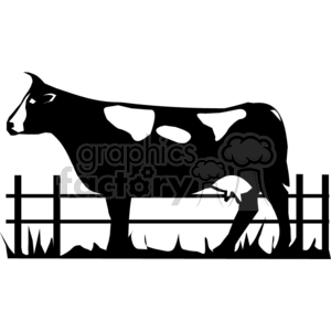 Silhouette of a cow with spots standing in front of a railed fence in a pasture.