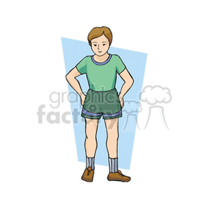 A boy standing with his hands on his tips in a green shirt and soccer shorts