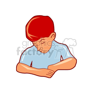 Red haired boy looking down at his hands