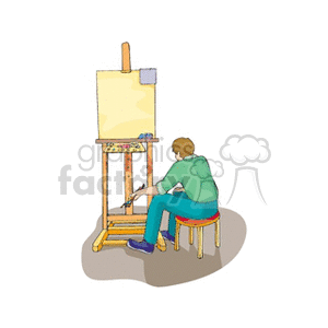 Male sitting in chair looking at a canvas