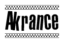 The image contains the text Akrance in a bold, stylized font, with a checkered flag pattern bordering the top and bottom of the text.