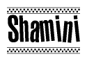 The image contains the text Shamini in a bold, stylized font, with a checkered flag pattern bordering the top and bottom of the text.