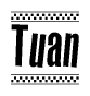 The image contains the text Tuan in a bold, stylized font, with a checkered flag pattern bordering the top and bottom of the text.
