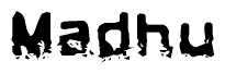 This nametag says Madhu, and has a static looking effect at the bottom of the words. The words are in a stylized font.
