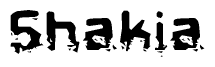 The image contains the word Shakia in a stylized font with a static looking effect at the bottom of the words