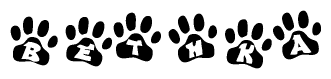The image shows a series of animal paw prints arranged in a horizontal line. Each paw print contains a letter, and together they spell out the word Bethka.