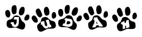 The image shows a series of animal paw prints arranged in a horizontal line. Each paw print contains a letter, and together they spell out the word Judah.