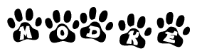 The image shows a series of animal paw prints arranged horizontally. Within each paw print, there's a letter; together they spell Modke