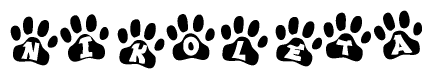 The image shows a row of animal paw prints, each containing a letter. The letters spell out the word Nikoleta within the paw prints.