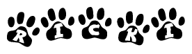 The image shows a row of animal paw prints, each containing a letter. The letters spell out the word Ricki within the paw prints.