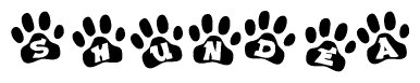 The image shows a series of animal paw prints arranged in a horizontal line. Each paw print contains a letter, and together they spell out the word Shundea.