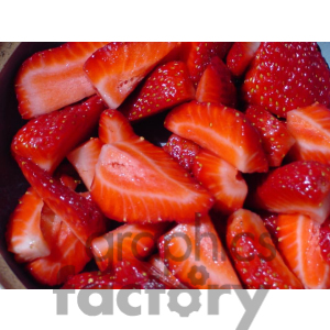 A close-up image of freshly cut strawberries, showcasing their bright red color and juicy texture.