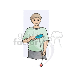 A boy playing with a paddle ball toy, featuring a paddle and a ball attached with a string.