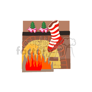 The image is a clipart representation of a cozy Christmas scene. It features a fireplace with bright orange and yellow flames. A red and white striped Christmas stocking is hanging on the right side of the fireplace mantle, and there are two small Christmas trees with pink decorations on top of the mantle. The background wall is brown, and the floor is a pale yellow, simulating a wooden texture.