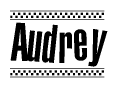 The image contains the text Audrey in a bold, stylized font, with a checkered flag pattern bordering the top and bottom of the text.