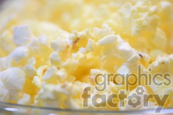 Close-up image of fluffy, buttery popcorn. The photo highlights the texture and golden-yellow color of the freshly popped kernels.