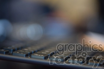 Blurred close-up of a computer keyboard with a shallow depth of field, creating a soft-focus effect.