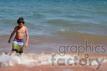 kid walking on the beach
